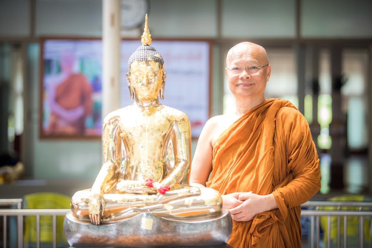 Venerable Luang Por Anan with Buddha statue